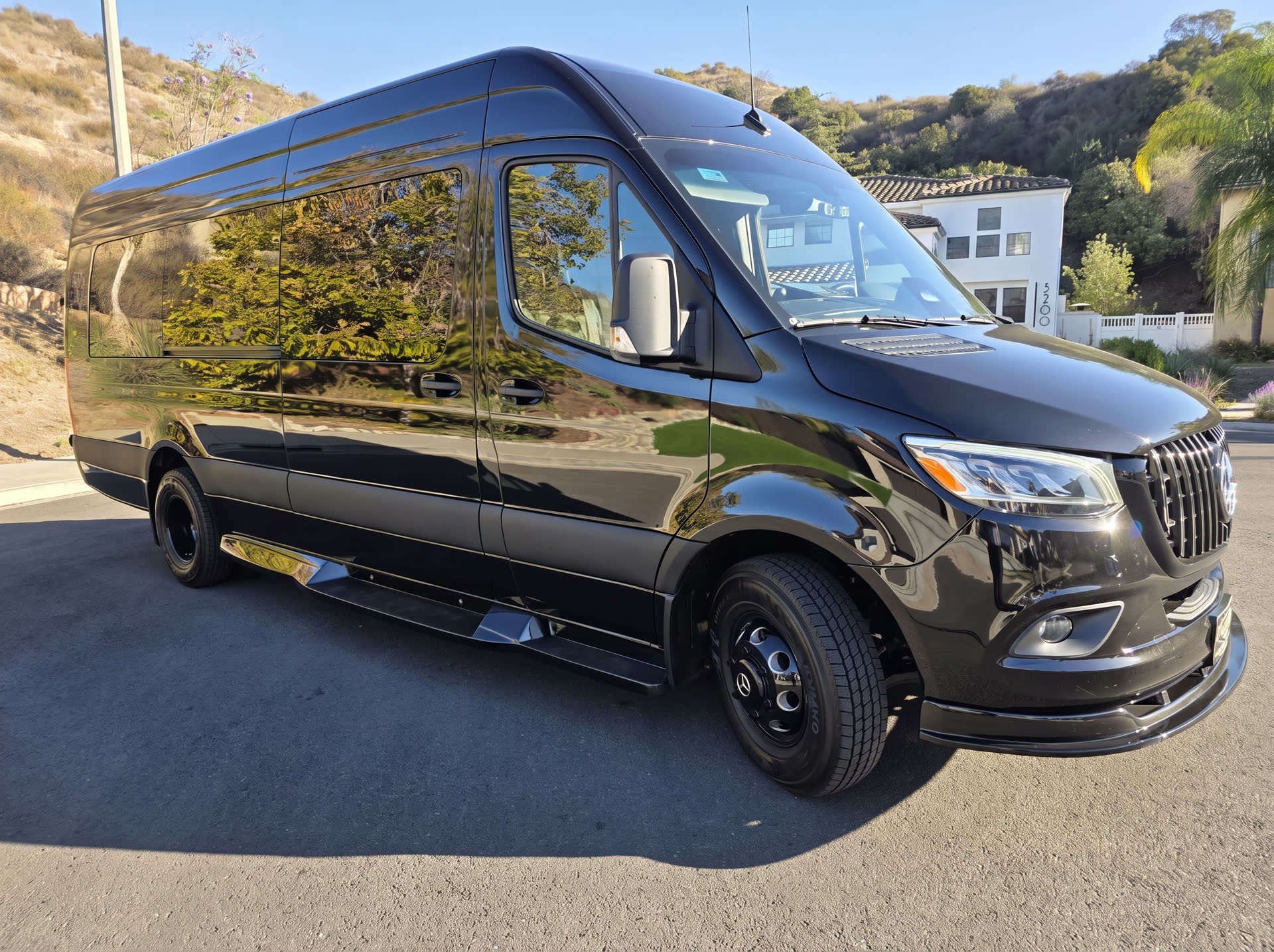 Black Mercedes-Benz Sprinter executive van for LA28 Olympic groups