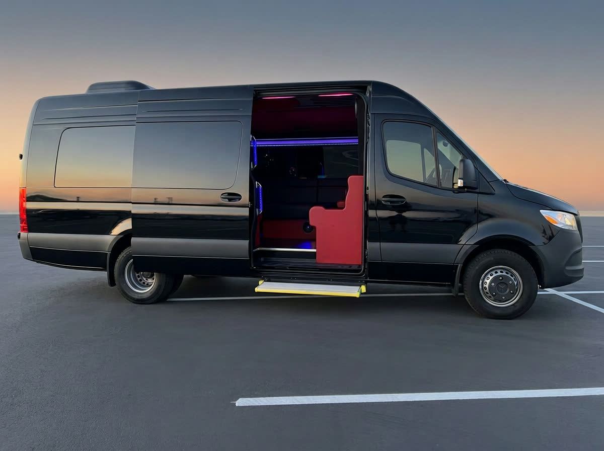 Black Mercedes-Benz Sprinter van with the sliding door open and a lit step